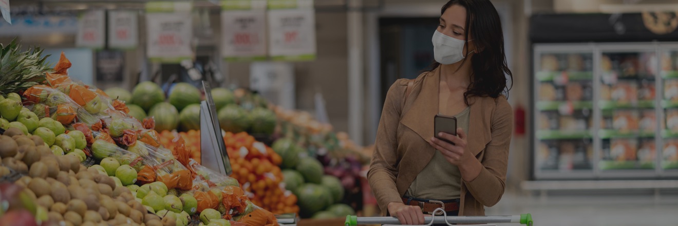 Woman looking at fruits at grocery store